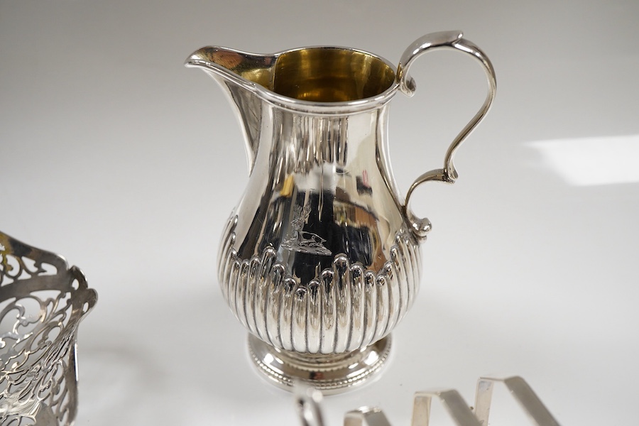 Sundry small silver including an Edwardian oval tea caddy, Hasseler Brothers, London, 1901, 10.4cm, a pierced bonbon dish, a late Victorian cream jug, five napkin rings including two pairs, a seven bar toast rack, a dama